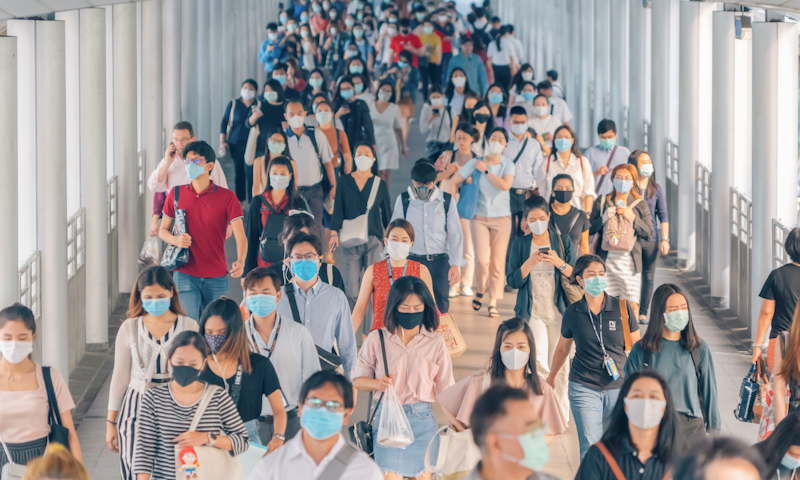 Crowd of people wearing masks