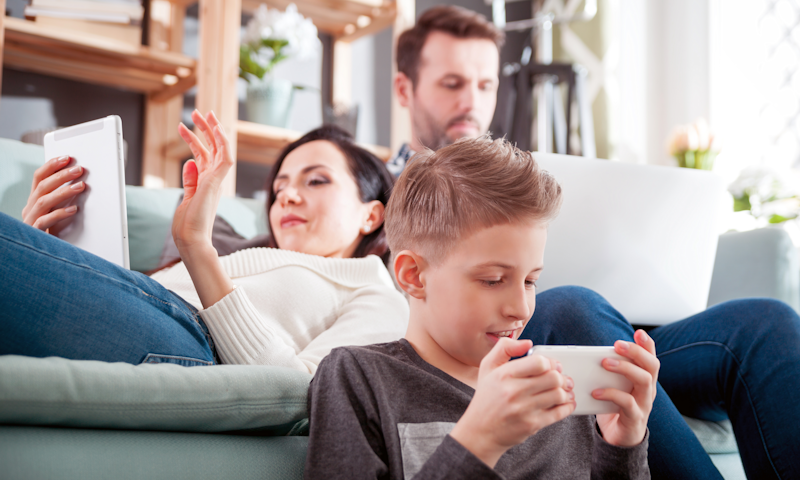 Parents and Child Using Digital Devices