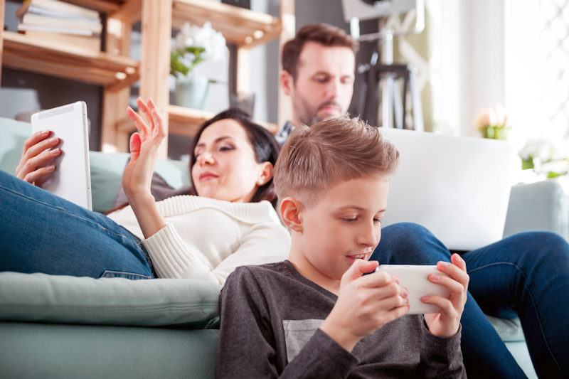 Parents and Child Using Digital Devices